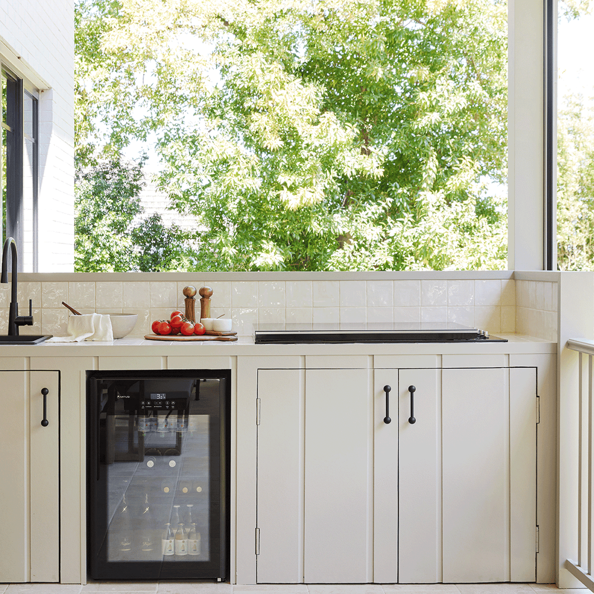 Artusi ABC1B bar fridge lifestyle - built into cabinetry in an entertaining space