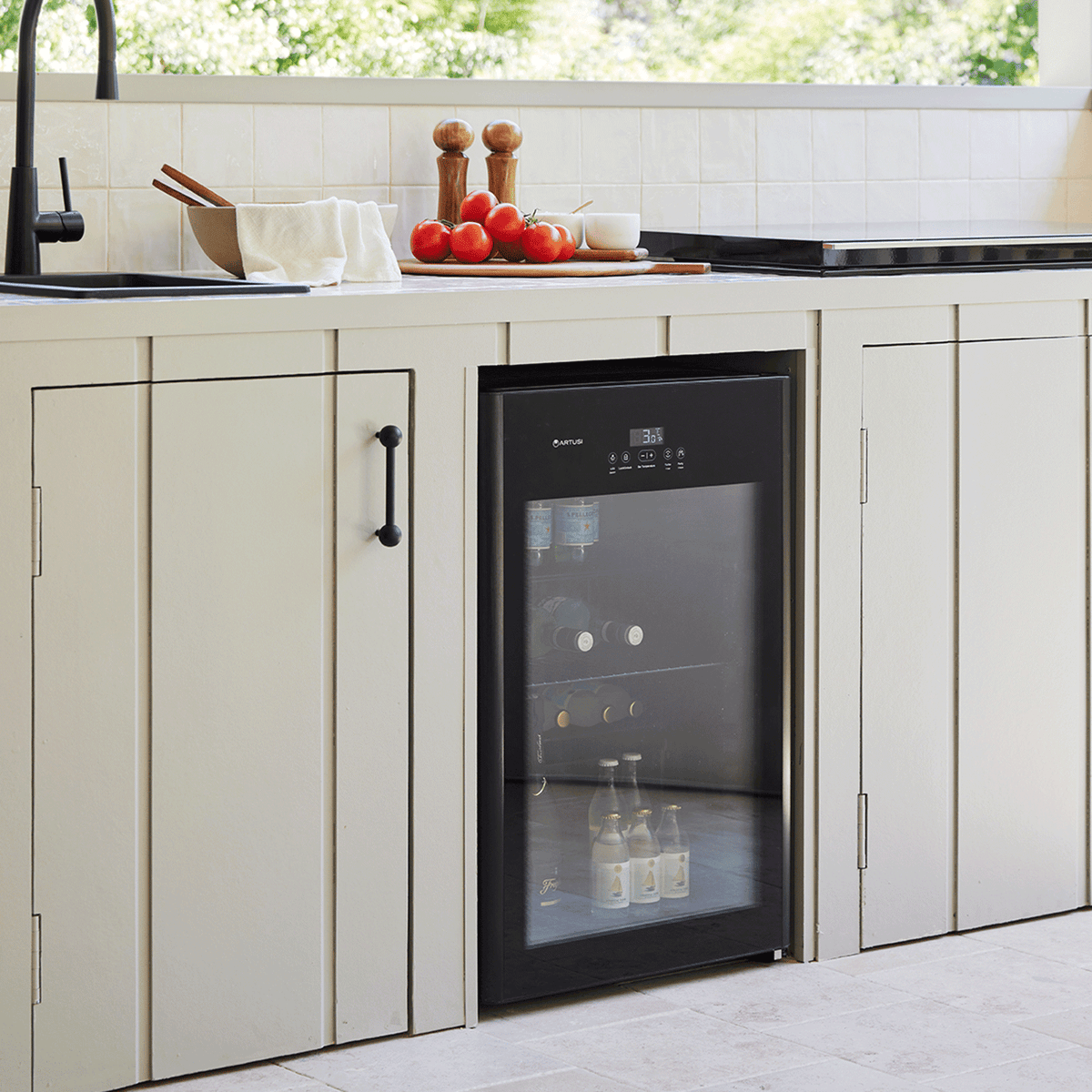 Artusi ABC1B bar fridge lifestyle - glass door fridge set into kitchen cabinetry