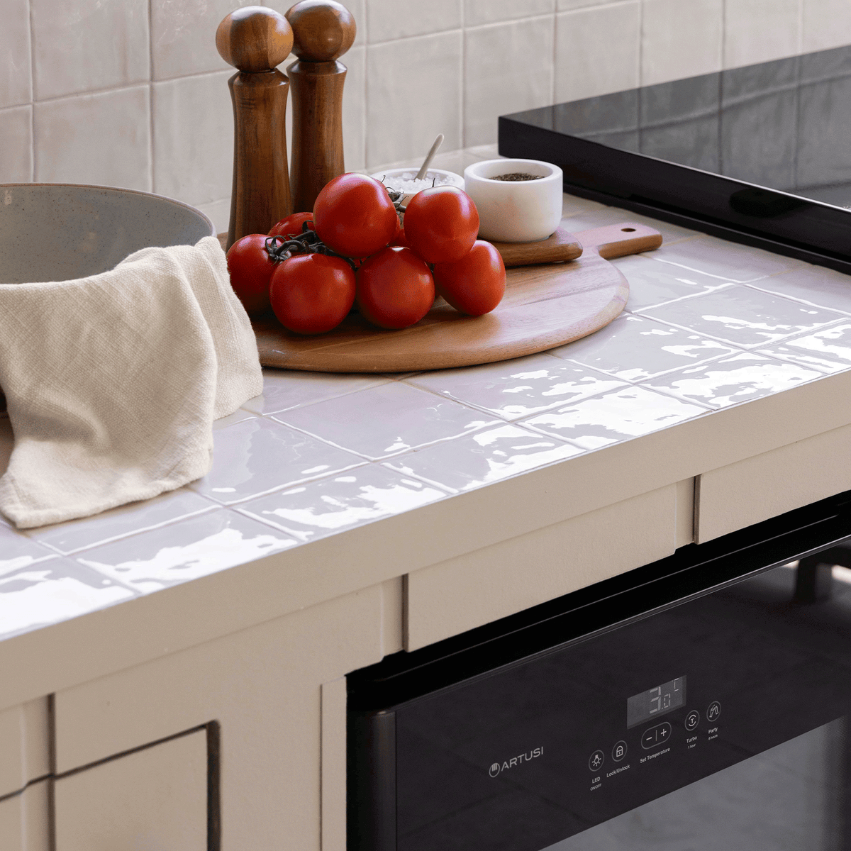 Artusi ABC1B bar fridge lifestyle - touch control panel on a benchtop