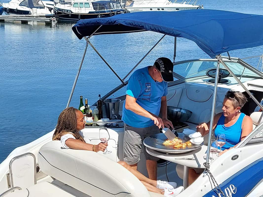 Cook N Dine portable teppanyaki grill in use outdoors on a boat