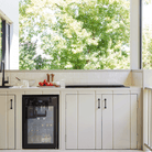 Artusi ABC1B bar fridge lifestyle - built into cabinetry in an entertaining space