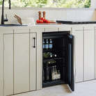 Artusi ABC1B bar fridge lifestyle - door open and stocked with bottles