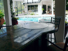 Cook N Dine UltraDine built-in teppanyaki grill installed in a poolside bench