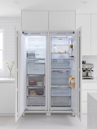 Kleenmaid CZ21911 and CR30911 fully integrated refrigerator and freezer in a white kitchen
