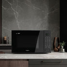 Whirlpool MWP421IB black microwave in a kitchen setting