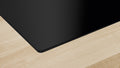 Bosch PVQ811H26E Series 6 Black Glass 80cm Wide Cooktop With Integrated Ventilation