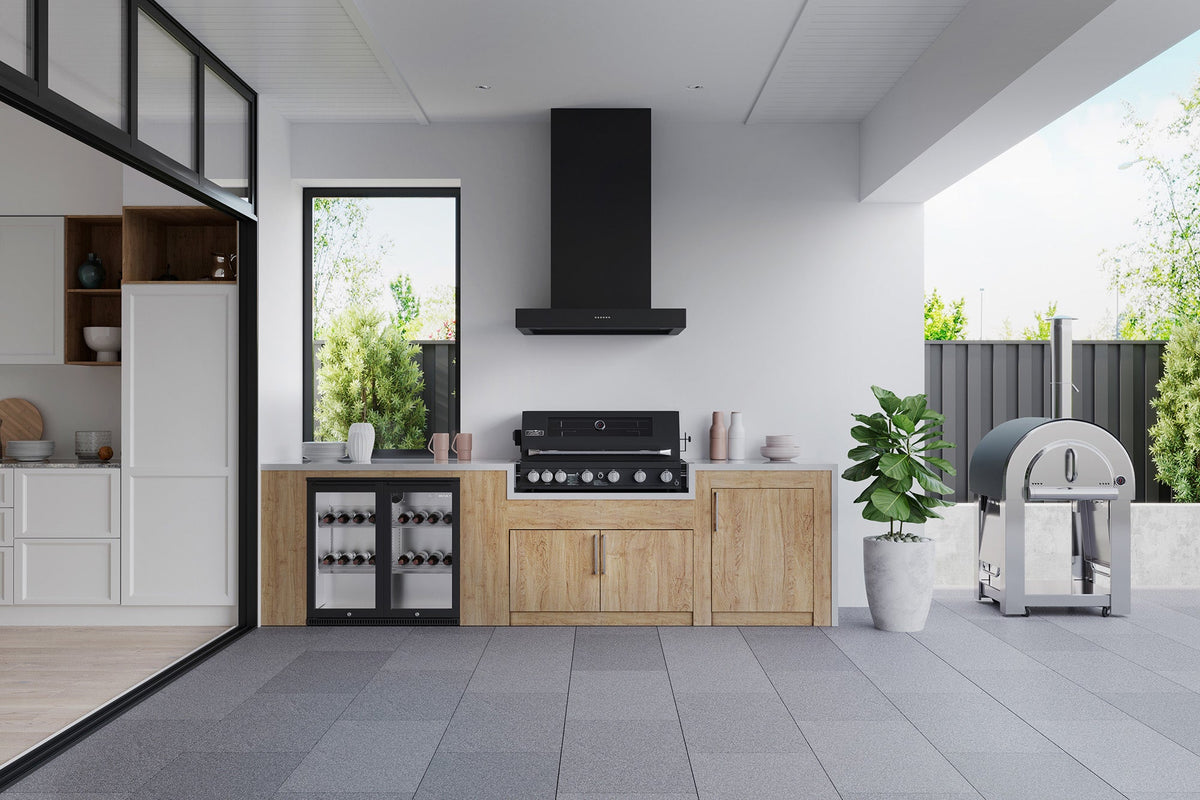 Smart 601WB black built-in gas BBQ in a modern outdoor kitchen with rangehood and pizza oven
