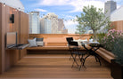 Smart WM700EW wall mounted electric BBQ on a rooftop terrace with city views and an outdoor dining setting