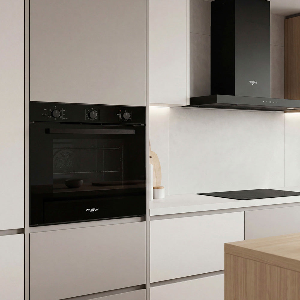 Whirlpool W3OMK35HR0BA black oven installed in a kitchen