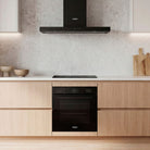 Whirlpool W3OMK35HR0BA black oven in a kitchen setting