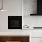 Whirlpool W3OMK35HR0BA black oven lifestyle image