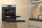Whirlpool W4OMK581HU1XAUS stainless steel oven with door open in a kitchen setting