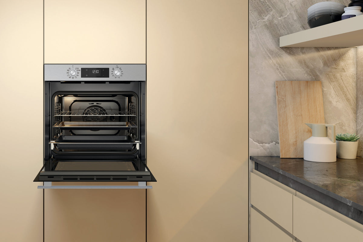 Whirlpool W4OMK581HU1XAUS stainless steel oven front view with door open in a kitchen