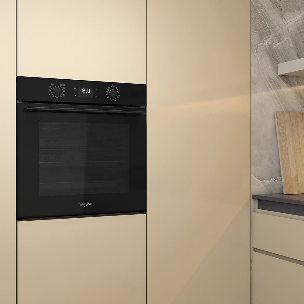 Whirlpool W4OMK581RU1BA black oven in a kitchen setting
