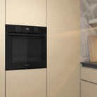 Whirlpool W4OMK581RU1BA black oven in a kitchen setting