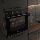 Whirlpool W4OMSK581RU1SBA black steam oven lifestyle image