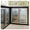 Artusi double door outdoor beverage chillers built into an outdoor kitchen counter