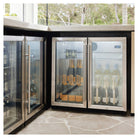 Artusi double door outdoor beverage chillers built into an outdoor kitchen counter